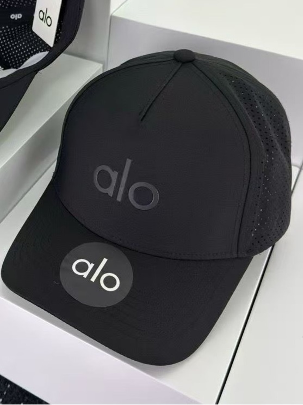 ALO Yoga Black Performance Trucker Hat with Subtle Logo